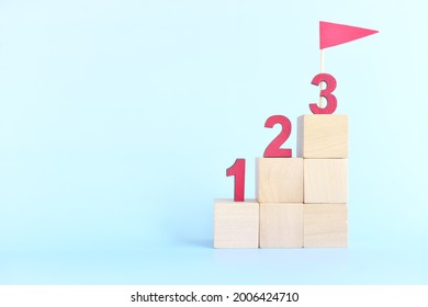 123 Numbers On Stairs Wooden Blocks. Small Steps Towards Goal Or Step By Step To Success Concept.