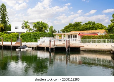 12575 Palm Rd, Miami, FL, USA
September 5, 2021

Oceanfront House With Open Views Of The Bay With Palm Trees And Neighboring Houses, Beautiful Blue Sky And Tropical Plants