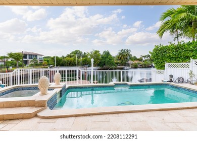 12575 Palm Rd, Miami, FL, USA
September 5, 2021

Oceanfront House With Open Views Of The Bay With Palm Trees And Neighboring Houses, Beautiful Blue Sky And Tropical Plants