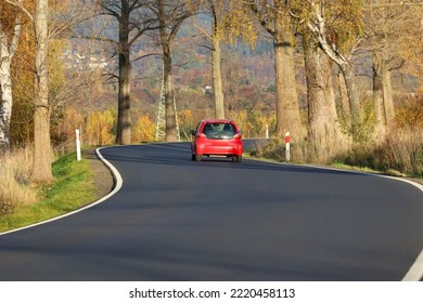 1-.27.2022 Wroclaw, Poland, A Winding Asphalt Road Will Run Through The Trees In Autumn.