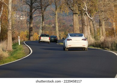 1-.27.2022 Wroclaw, Poland, A Winding Asphalt Road Will Run Through The Trees In Autumn.