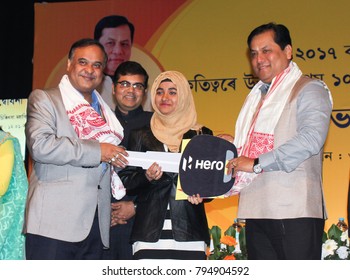 12th January 2018, Guwahati, Assam, India. Assam Chief Minister Sarbananda Sonowal And Education Minister Dr Himanta Biswa Sarma Give Away Scooter To  Girl Students.  Scored Highest Marks In HS Exam.