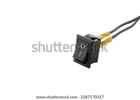 12v - 24v switch button connected to wires, cut out on isolated white
