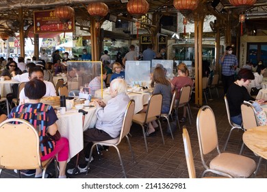 13 11 2021 People Eat Famous Chinese Sea Food In Restaurant In Sai Kung, Hong Kong During Covid-19 Omicron Period. Plastic Shield Partition Between Tables To Keep Social Distance 