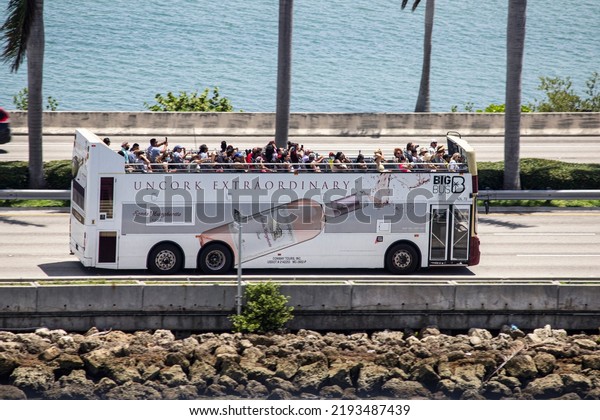 14 January 2022, Miami, USA | An Open bus in Miami with
full of tourists and passengers going for city tour image
background  