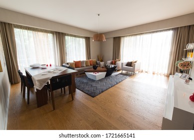 14 July 2019, İstanbul, Turkey: Beautiful Living Room Interior With Hardwood Floors In New Luxury Home. Large Bank Of Windows Hints At Exterior View