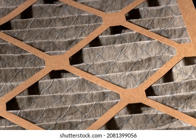 14 X 14 X 1 Size Dirty Home Air Filter Close Up That Needs To Be Replaced.