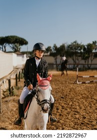 14 Year Old Teenager Jogging White Horse With Pink Earmuffs