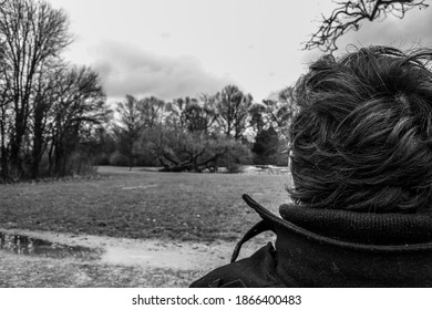 14.02.2012. Amsterdam. Netherland. A Alone Man Back Side, Who Is Looking For The Nature In Park Amsterdam. Black And White Photo.