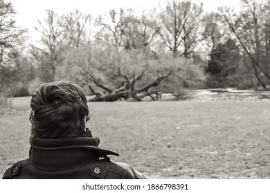 14.02.2012. Amsterdam. Netherland. A Alone Man Back Side, Who Is Looking For The Nature In Park Amsterdam. Black And White Photo.