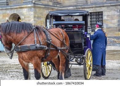 14.02.2012. Amsterdam. Netherland. Horse Cart In Royal Palace Square During Winter And Cold Day. Beautiful Horse And Old Costumed Man