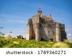 14th century ruins of Mirow Castle in Poland. Medieval, monumental, stone building lies on a hill, surrounded by limestone rock formations. A romantic castle in the Eagle Nests trail. Sunny summer sky