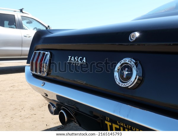 14th May 2022- A black Ford\
Mustang Tasca parked on Pendine Sands in Carmarthenshire, Wales,\
UK.