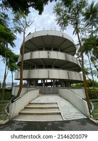 15 April 2022, Singapore: Portrait Shot Of Jurong Hill Observatory Tower With Foliage Around It And Cloud Skies.