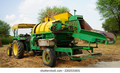 15 August 2022, Sikar, India. Grain Harvester With Thresher Tractor. Tractor With Thresher Machine Closeup In Agriculture Field.