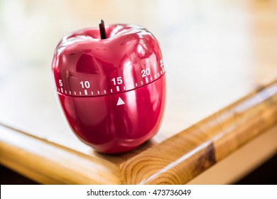 15 Minutes - Kitchen Egg Timer In Apple Shape On Wooden Table