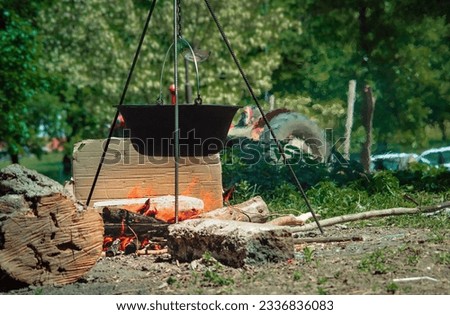 15.05.2022. Kragujevac, Serbia. Cityscape photos. Picnic in the park, cast iron cauldron over the campfire.