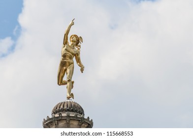 1598 Mercury Pillar Golden statue at Schlossplatz in Stuttgart, Germany