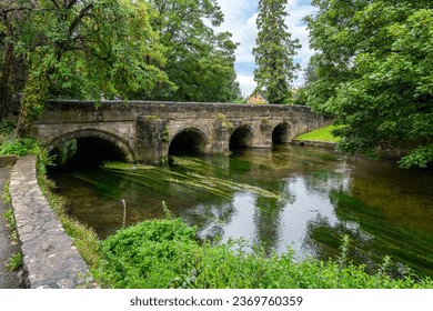 The 15th Century Crane Bridge as it crosses the River Avon in the historic center of Salisbury, Wiltshire, England UK. - Shutterstock ID 2369760359