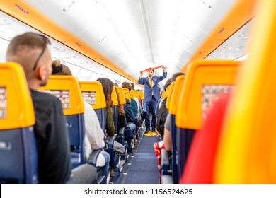 16 MAY 2018, BUDAPEST HUNGARY: Passengers Seating And Listening To The Crew Members Steward Safety Instructions Inside The Ryanair Airlines Plane