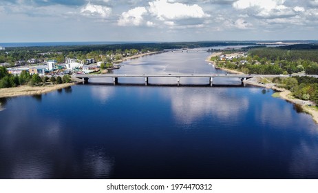 16 may 2021 bird’s eye view of Jurmala bridge Lielupe river on a rare sunny day in Latvia. The road from Riga, capital of Latvia to resort town Jurmala. And on the left there is Livu aquapark