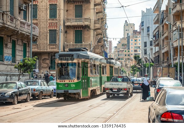 16/11/2018 Alexandria, Egypt, the\
streets of an ancient African city filled with people and\
trams