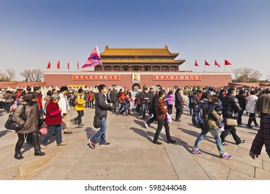 17 March 2011: Beijing, China - Chinese Tourists And Tour Guide Walking Outside The Tian'anmen Gate, The Gate Of Heavenly Peace, Entrance To The Forbidden City, Beijing, China.