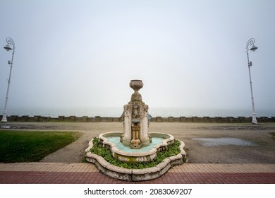 17th century water fountain of the Palic Lake, in Subotica, Serbia during a autumn foggy rainy afternoon sunset. Also known as Palicko Jezero, it is one of the main attractions of Vojvodina province.
 - Shutterstock ID 2083069207