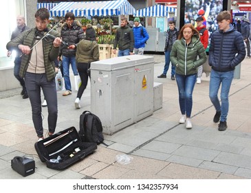 17th March 2019, Dublin, Ireland. Busker Playing A Violin On Henry Street Near The Moore Street Stalls. 