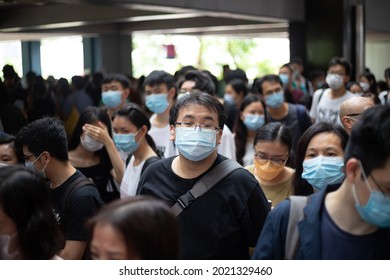 18 7 2021 Poker-faced People Feel Tired Or Worn Out In Blurred Crowd With Face Mask In Hong Kong. Hard To Keep Social Distance. Pandemic Fatigue Problem During Long Term Covid-19