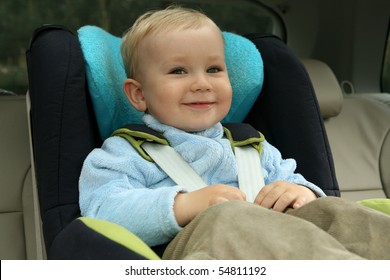 18 Months Old Baby Boy In Car Safety Seat.