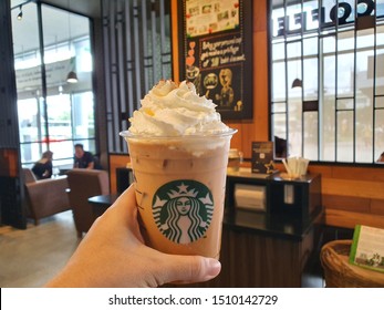 18 Sep 2019: Nonthaburi Thailand; Handed Starbucks Pumpkin Latte At Starbucks Cafe Coffee Shop