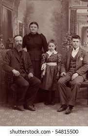 A 1800's Antique Vintage Portrait Photograph Of A Family Posing For The Camera. It Is A Studio Formal Photo Of A Quaker Family.