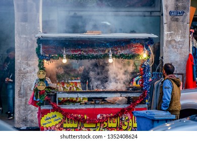 18/02/2019 Jordan, Amman, A Street Vendor, Fry Tasty Meat On His Counter And People Are Right To Buy Food From Him. Fastfood Concept.selective Focus