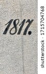 "1817" carved in a stone and painted in black – a detail of an inscription produced that year