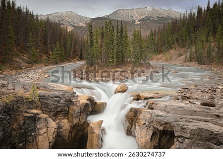The 18.5 m drop Upper Sunwapta Falls on the Sunwapta (Turbulent Water) River, backed E-NE by (R-L) the 2867 m Shackle Peak, 2704 m Endless Chain Ridge and 2730 m Shackle NW2. Jasper NP-Alberta-Canada.