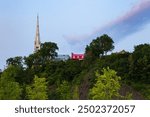 The 1854 Saint-Michel-de-Sillery church and historic houses dominating a cape seen during a beautiful early summer morning in the Sillery area, Quebec City, Quebec Canada