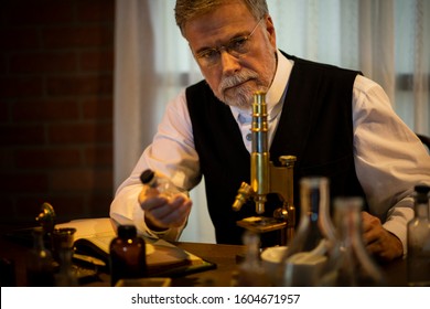 1885 scientist thinking while holding a drug
