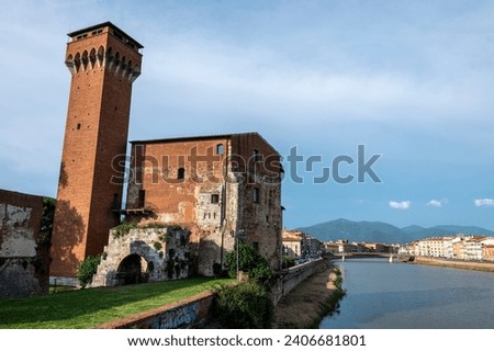 The 18m high Torre Guelfa (Guelph Tower) of Cittadella Vecchia was constructed in 1407 of  Renaissance architecture. It sits on the banks of the Amo river in Pisa in the Tuscany region of Italy. 

