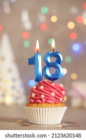 18th Birthday. Delicious Cupcake With Number Shaped Candles For Coming Of Age Party On Table