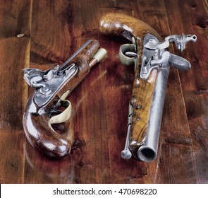 18th century English flintlock pistols.