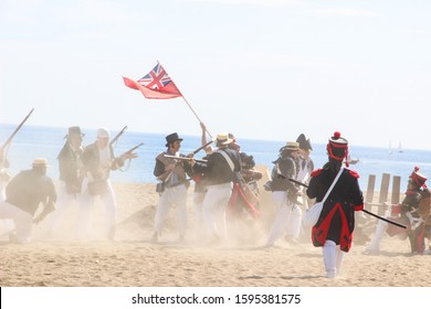 18th Century Troops Of The Royal Navy Fight Against French Soldiers. Historical Reenactment Of The British Landing Of 1812. Assault On A Napoleonic Corsair Base. Málaga, Spain - October 26, 2014.