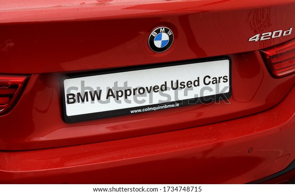 18th May 2020, Drogheda,
Ireland. The back of a BMW 420d red car with a registration plate
saying 