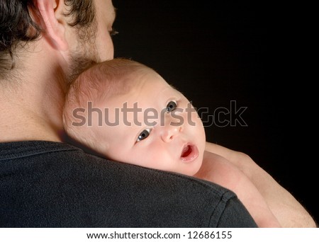 19 days old baby girl feeling secure on his Dad's shoulder