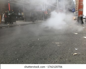 19 February 2018 - New York City: Hot Steam Being Released From  A Manhole Cover In The Street In Midtown Manhattan.  Hot Steam Being Releases From The Underground Heating System In NYC.