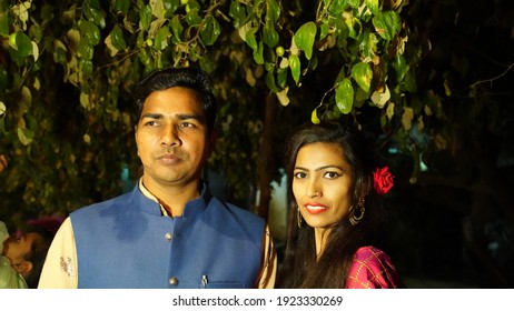 19 February 2021- Sikar, Jaipur, India. Cheerful smiley face of Hindu Brother and sister, giving a shot in tree shadow. Nature shot in forest at the night.
