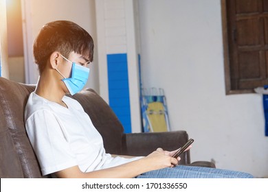 19 Year Old Boy Is Playing The Phone And Putting The Mask On The Face, Detained In The House ,Udon Thani, Thailand, Sunday, April 12, 2020, 12:56:43 PM