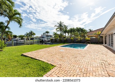 1905 Keystone Blvd, Miami, FL May 11 2021, USA

Patio With Pool, Wooden Party Wall, Tropical Plants , Waterfront, Yachts And Blue Sky