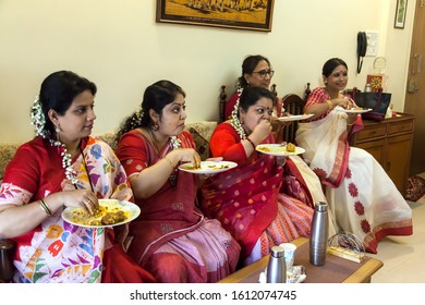 19-05-2019 – 14:54:08, in a get-together a section of group were having food but their attention were somewhere else, at Narol a distant suburbs of Mumbai India  - Shutterstock ID 1612074745