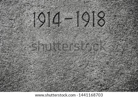 1914-1918 carved on a wall.Number 1914 on monument for the dead of the First World War. stone background texture. 
